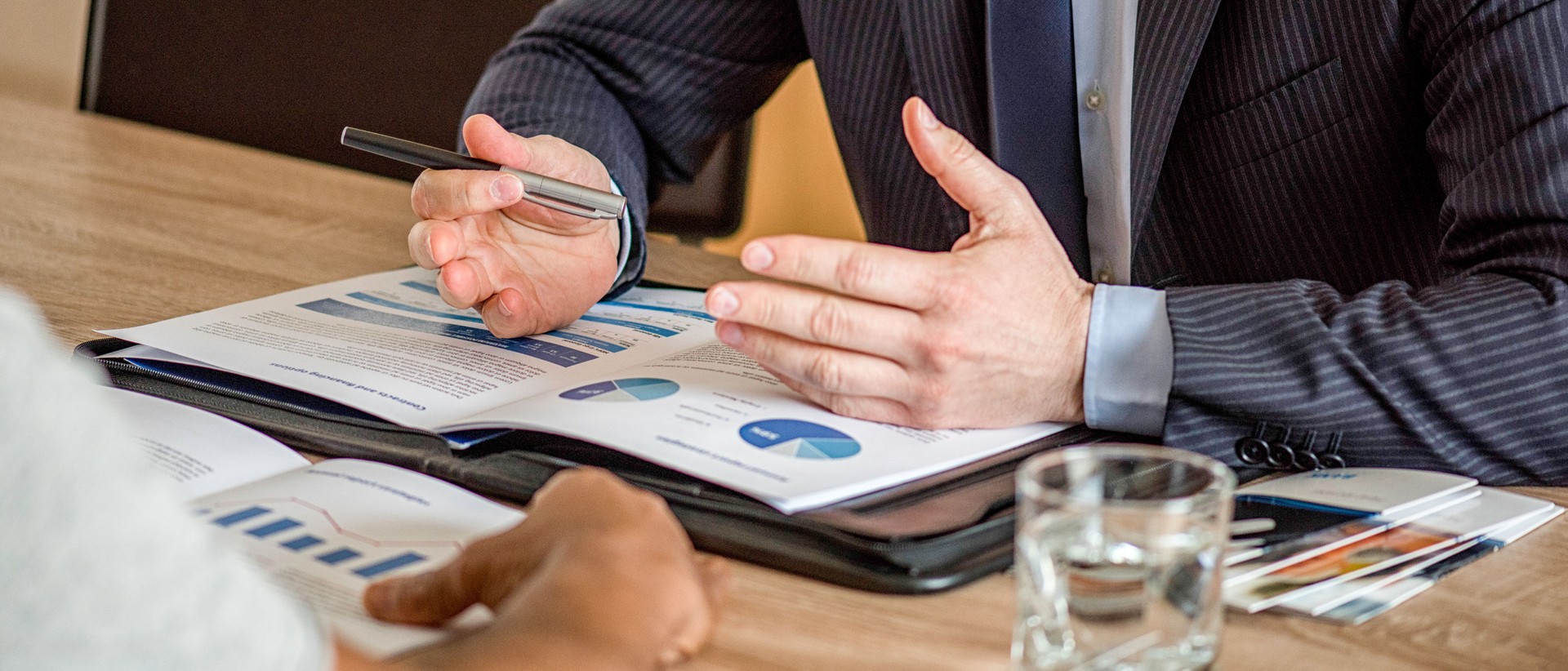 Close up of male hands on business document